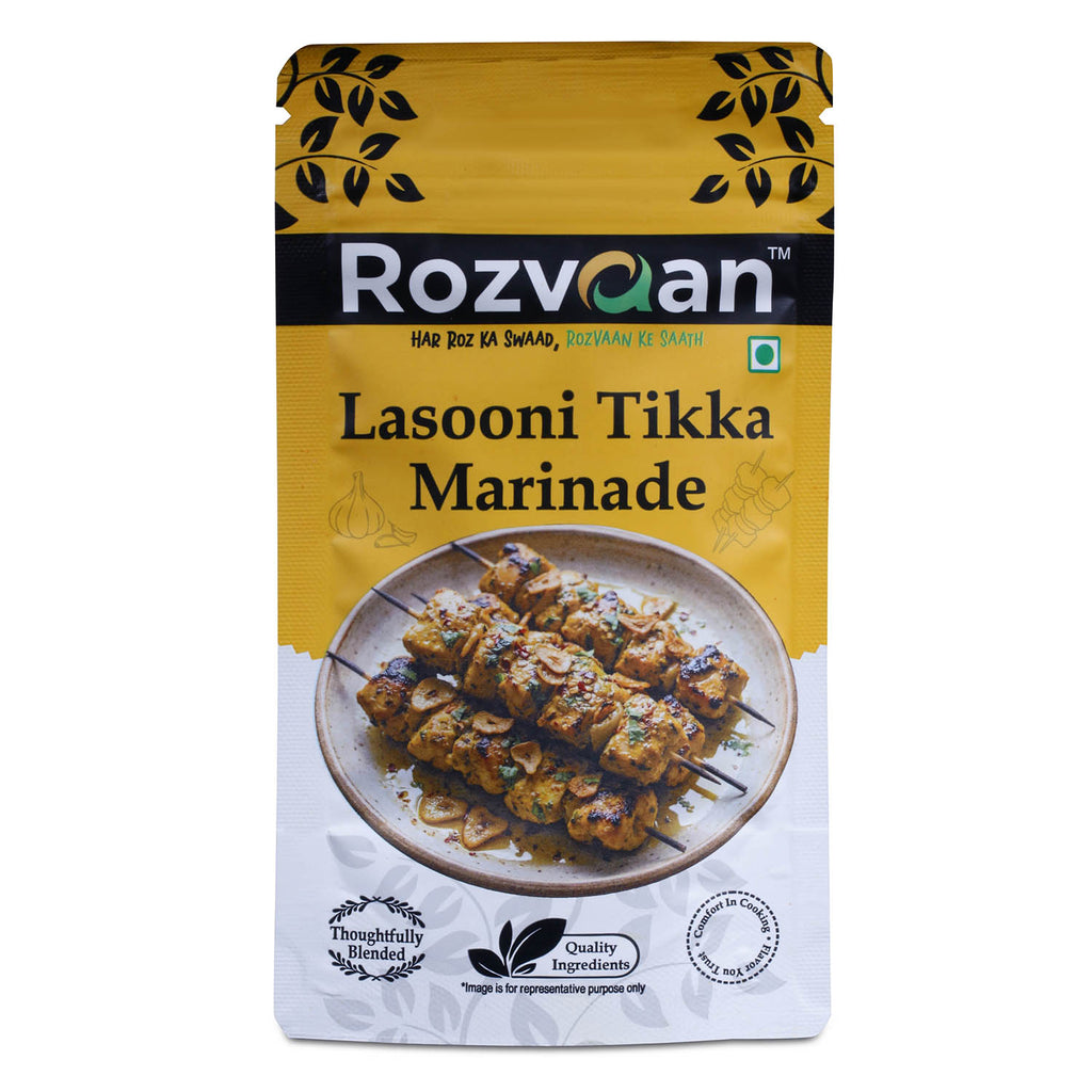 Rozvaan Lasooni Tikka Marinade in a bottle, showcasing the flavorful garlic marinade for tikka and grilling dishes.
